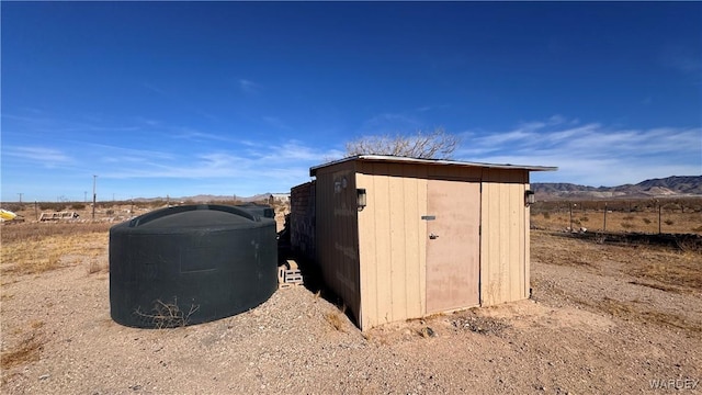 view of shed featuring a mountain view and a rural view