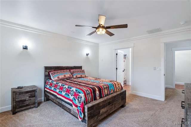 carpeted bedroom with baseboards, a ceiling fan, and ornamental molding