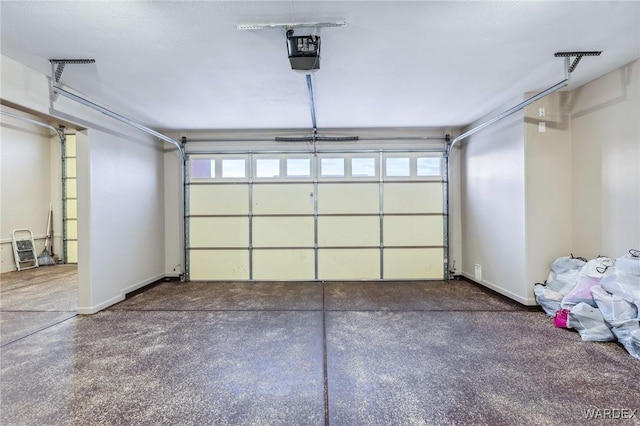 garage featuring baseboards and a garage door opener