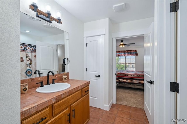 ensuite bathroom featuring visible vents, ceiling fan, tile patterned floors, ensuite bathroom, and vanity