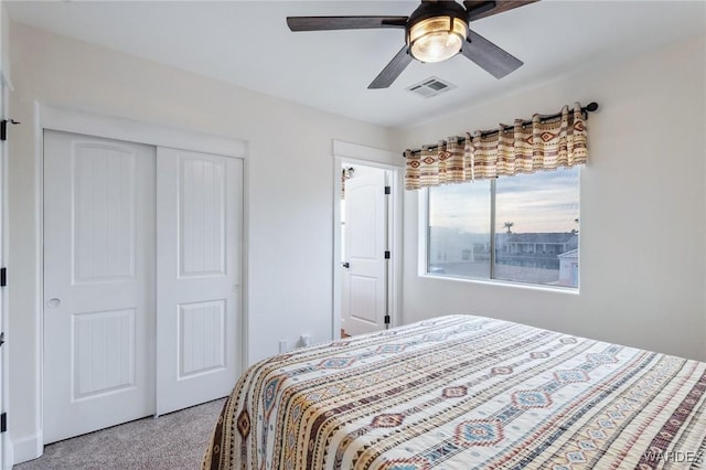 bedroom with ceiling fan, a closet, and visible vents