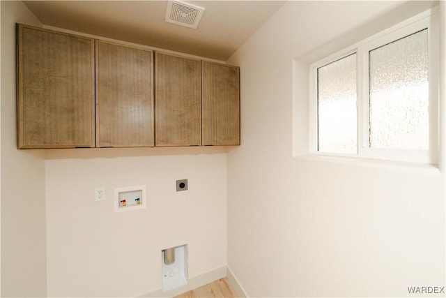 laundry room featuring cabinet space, baseboards, visible vents, hookup for an electric dryer, and washer hookup