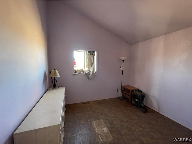 interior space featuring visible vents and vaulted ceiling