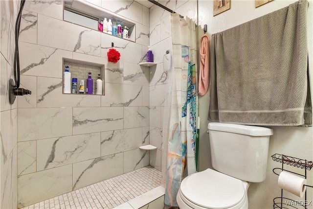 full bath with a shower stall and toilet