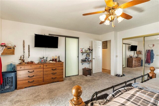 bedroom with light carpet and ceiling fan