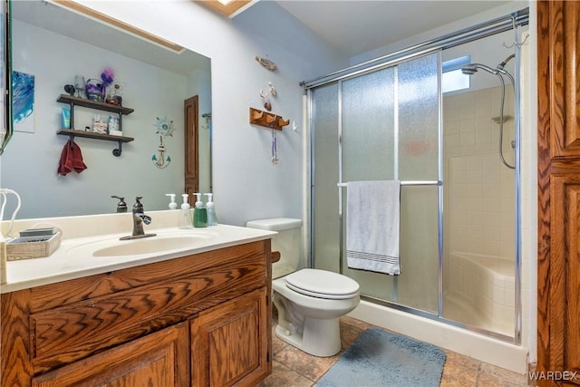 full bathroom with toilet, a shower stall, and vanity