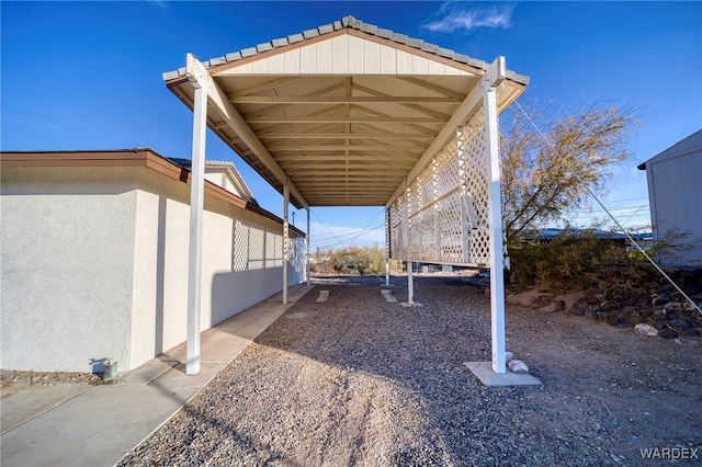 exterior space with a carport