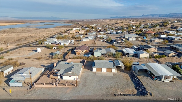 birds eye view of property with a residential view and a water and mountain view