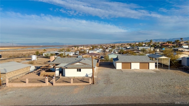 birds eye view of property with a residential view and a mountain view