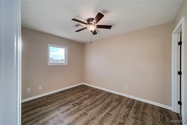 unfurnished bedroom featuring dark wood-type flooring, ceiling fan, and baseboards