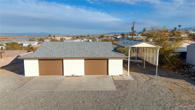 detached garage featuring a mountain view