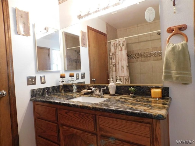 bathroom with vanity and a shower with curtain