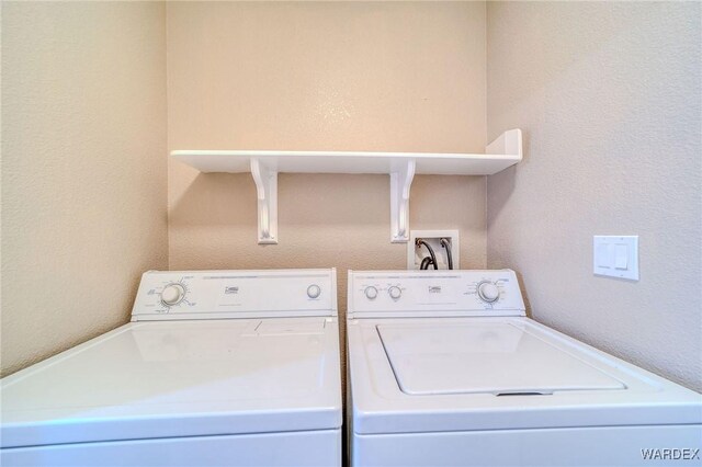 laundry room featuring separate washer and dryer