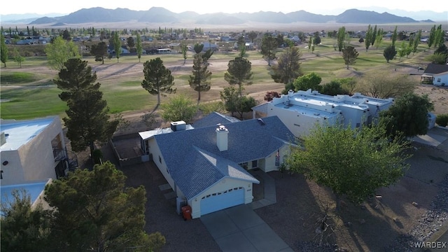 drone / aerial view featuring a mountain view