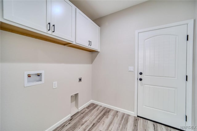 laundry area with hookup for a washing machine, cabinet space, light wood-style floors, hookup for an electric dryer, and baseboards