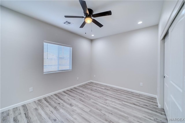 spare room with recessed lighting, visible vents, light wood-style flooring, a ceiling fan, and baseboards