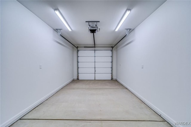 garage featuring baseboards and a garage door opener