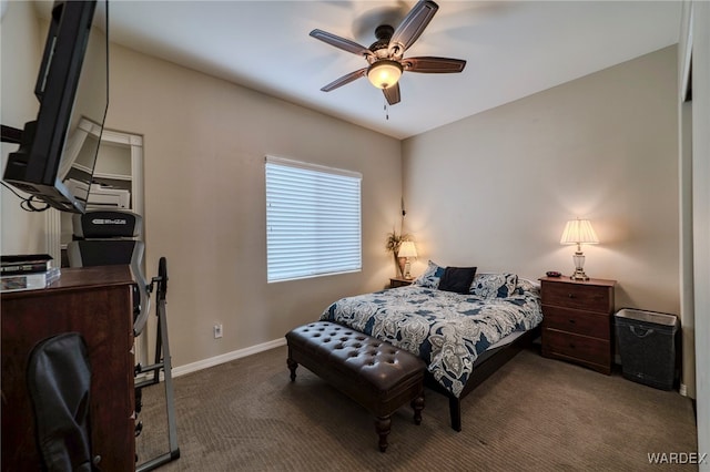 carpeted bedroom with a ceiling fan and baseboards