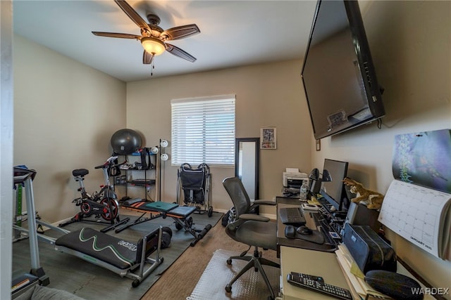 office featuring baseboards and a ceiling fan