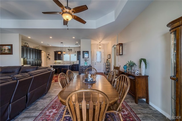 dining space featuring a ceiling fan, wood finish floors, baseboards, and recessed lighting