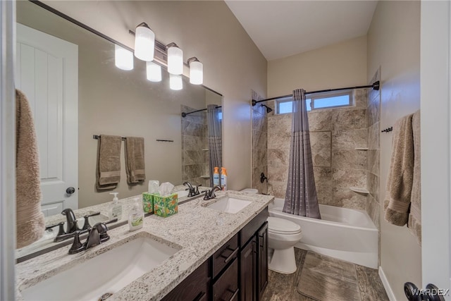 bathroom with double vanity, a sink, toilet, and shower / tub combo with curtain