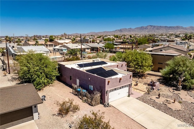 drone / aerial view with a residential view and a mountain view