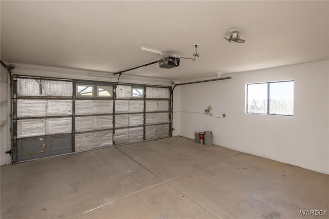 garage featuring a garage door opener