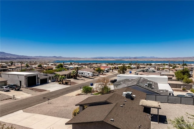 drone / aerial view featuring a residential view and a mountain view