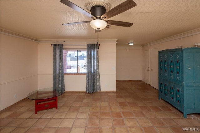 unfurnished room with ceiling fan and ornamental molding