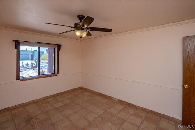 unfurnished room featuring ornamental molding, baseboards, and a ceiling fan