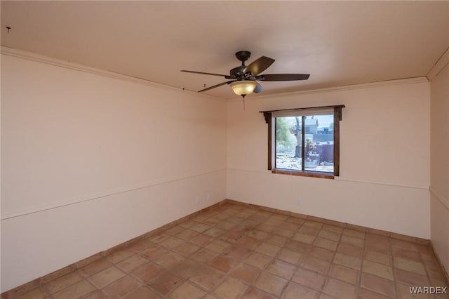 unfurnished room featuring a ceiling fan, baseboards, and crown molding