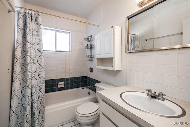 full bathroom with toilet, shower / bath combo with shower curtain, and vanity