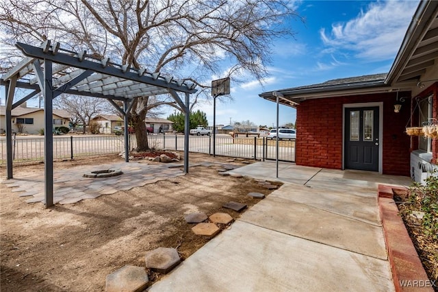 view of patio / terrace featuring a fire pit, a gate, fence, and a pergola