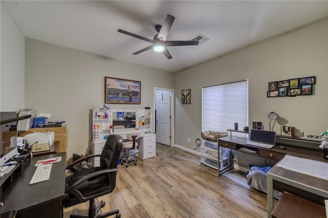 1919 Richardo Ave, Bullhead City, AZ 86442 - home office featuring a ceiling fan and wood finished floors