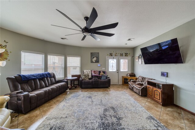 1919 Richardo Ave, Bullhead City, AZ 86442 - living area with light tile patterned floors, ceiling fan, and baseboards