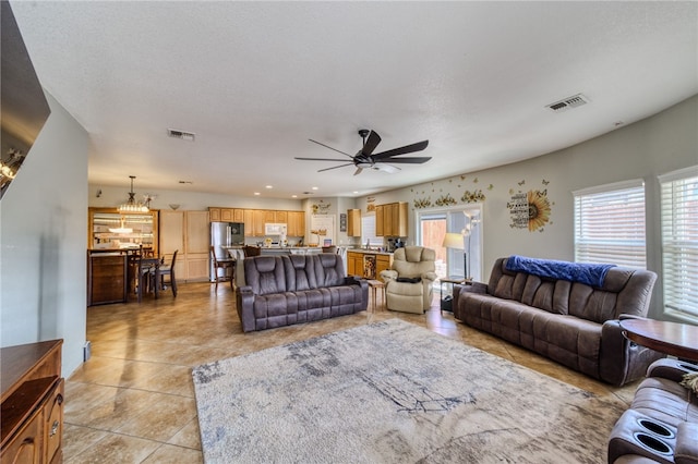 1919 Richardo Ave, Bullhead City, AZ 86442 - living room featuring a chandelier, a ceiling fan, light tile patterned flooring, and recessed lighting