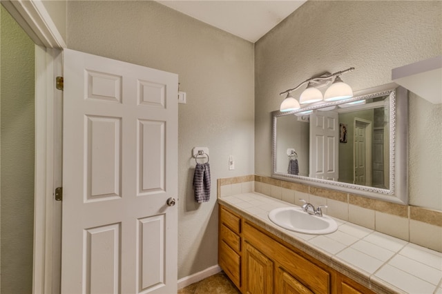1919 Richardo Ave, Bullhead City, AZ 86442 - bathroom featuring vanity and decorative backsplash