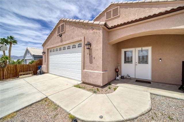1919 Richardo Ave, Bullhead City, AZ 86442 - view of home's exterior featuring stucco siding, driveway, a garage, and fence