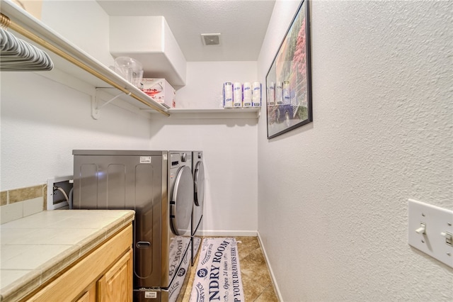 1919 Richardo Ave, Bullhead City, AZ 86442 - clothes washing area featuring separate washer and dryer and baseboards
