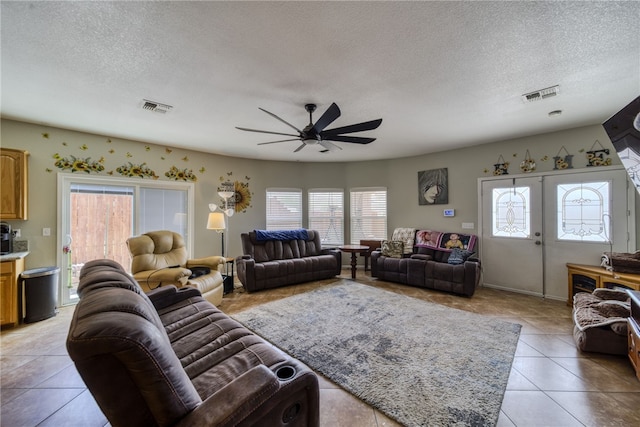 1919 Richardo Ave, Bullhead City, AZ 86442 - living area with ceiling fan, light tile patterned floors, and a textured ceiling