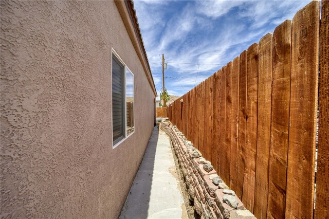 1919 Richardo Ave, Bullhead City, AZ 86442 - view of side of home featuring stucco siding and fence