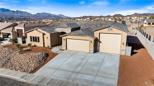 ranch-style home featuring a residential view, stone siding, and a mountain view