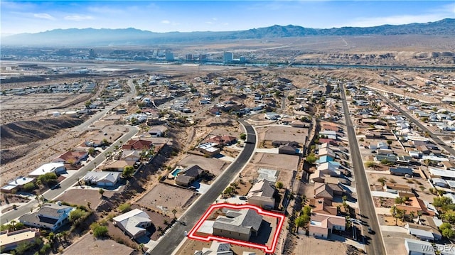 drone / aerial view featuring a residential view and a mountain view