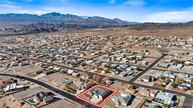 drone / aerial view with a residential view and a mountain view