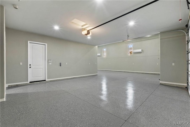 garage featuring baseboards and a garage door opener