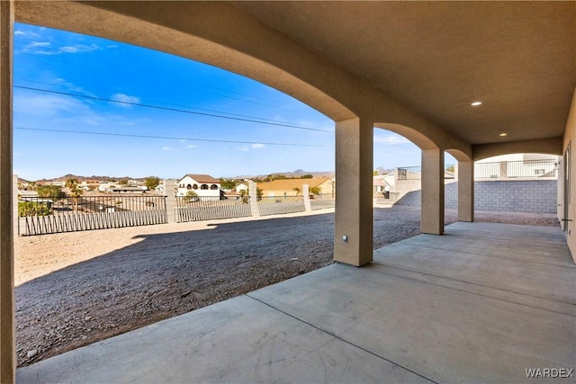 view of patio / terrace featuring a fenced backyard and a residential view