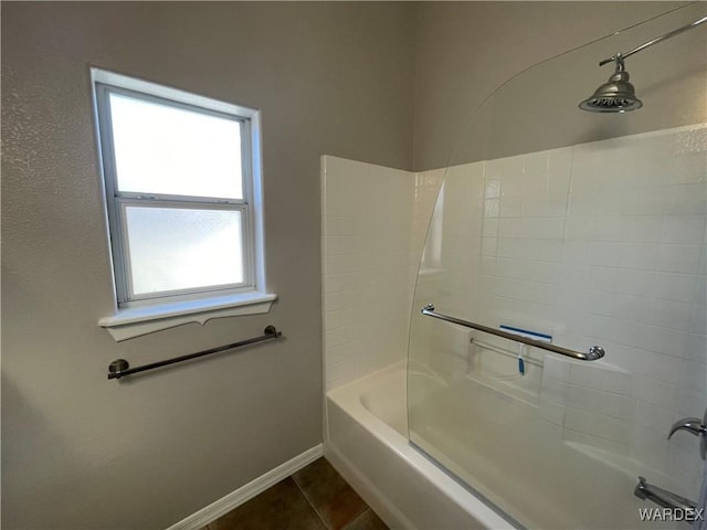 full bathroom with shower / bathtub combination, tile patterned flooring, and baseboards