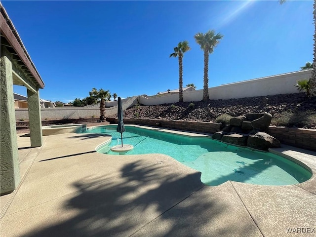 view of pool featuring a fenced in pool, a patio area, and a fenced backyard