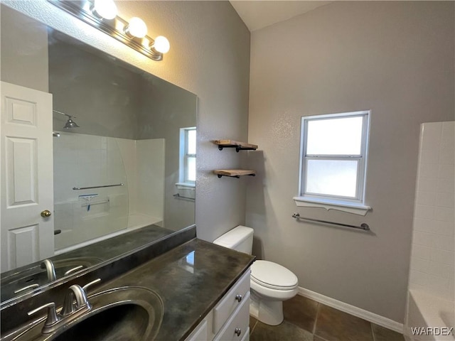 bathroom featuring shower / bathtub combination, toilet, vanity, tile patterned flooring, and baseboards