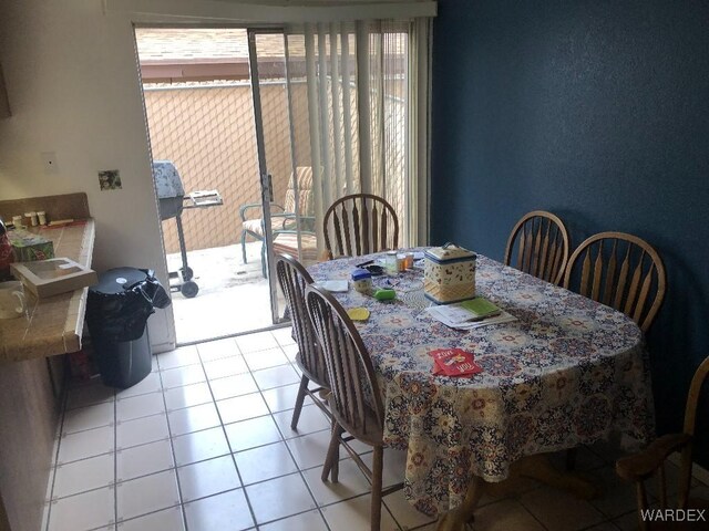 dining room featuring light tile patterned floors